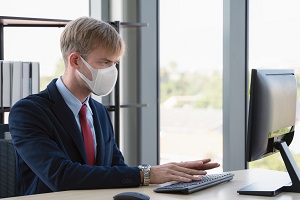 caucasian businessman with medical mask for coronavirus covid-19